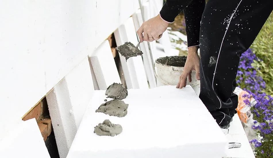 Co wchodzi w skład elewacji budynku? Kluczowe elementy i materiały